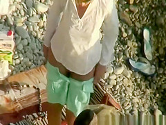 Short hair woman rides cock in beach