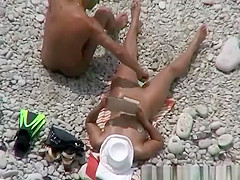 Nudist woman fingered at beach