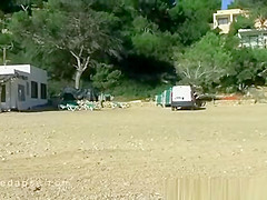 Girl peeing on the beach