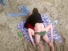 Clothed woman fucked in the beach