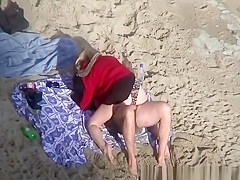 Clothed woman fucked in the beach