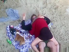 Clothed woman fucked in the beach