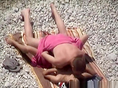 Couple secretly filmed in the rocky beach fucking