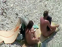 Nudist couple spied having sex on the beach