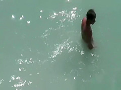 Nudist couple spied having sex on the beach