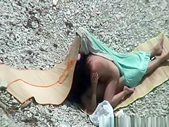 Nudist couple spied having sex on the beach