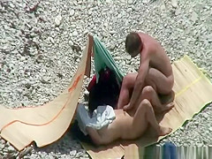 Nudist couple spied having sex on the beach