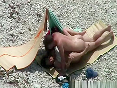 Nudist couple spied having sex on the beach
