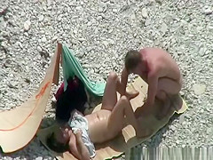Nudist couple spied having sex on the beach