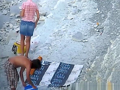 Nudist woman blows cock in beach