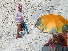 Nudist woman blows cock in beach