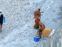 Nudist woman blows cock in beach