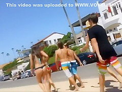 Following girls in thong bikinis to beach