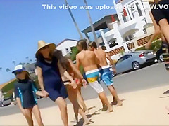 Following girls in thong bikinis to beach