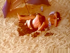 Chubby woman blows cock in the beach
