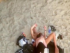 Chubby woman blows cock in the beach