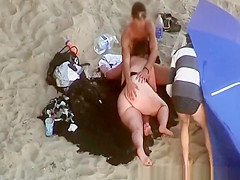 Chubby woman blows cock in the beach