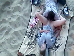 Teen couple oral sex on the beach