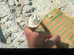 Mature nudist couple spied in rocky beach