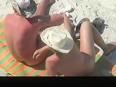 Mature nudist couple spied in rocky beach