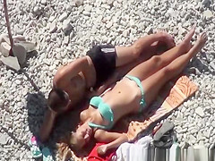 Pussy fingering and handjob at beach