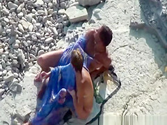 Couple fucking in the water and shore