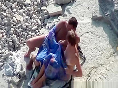 Couple fucking in the water and shore