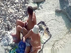 Couple fucking in the water and shore