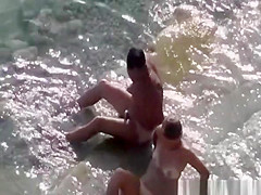 Couple fucking in the water and shore