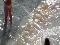 Couple fucking in the water and shore