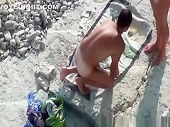 Couple fucking in the water and shore