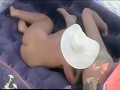 Couples having sexual moments at beach