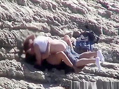 Couple spied fucking in rocky beach