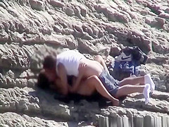 Couple spied fucking in rocky beach