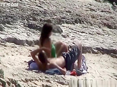Couple spied fucking in rocky beach
