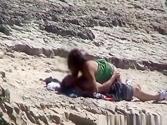 Couple spied fucking in rocky beach