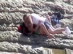 Couple spied fucking in rocky beach