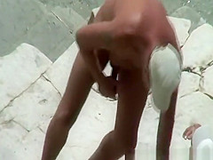 Nude man fingers his wife's trimmed pussy