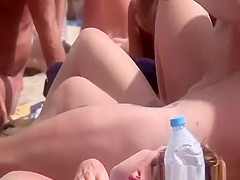 Blowjob in crowded nudist beach