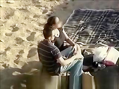 Couple caught on the beach
