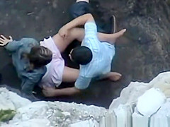 Lovers on Rocky Beach