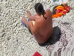 Chubby nudist sucking his cock