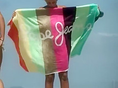 Busty lesbians topless in the beach