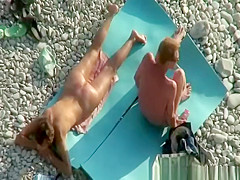 Nudist couple fucking in rocky beach