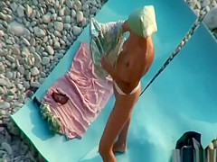 Nudist couple fucking in rocky beach