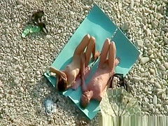 Nudist couple fucking in rocky beach