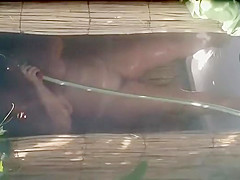 Mature woman spied during a shower