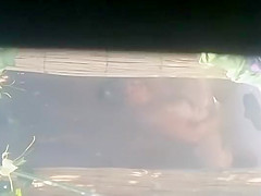 Mature woman spied during a shower