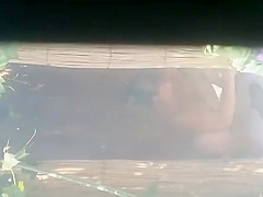 Mature woman spied during a shower