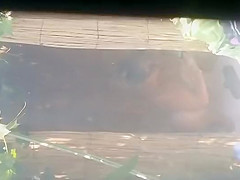 Mature woman spied during a shower